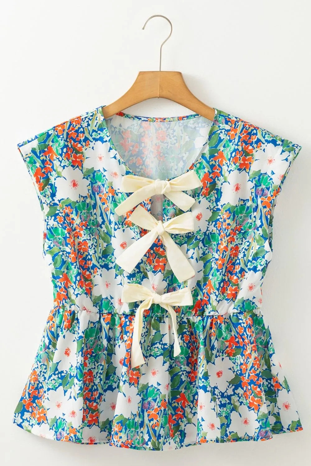 Floral Print Bow Applique Slit Sleeveless Peplum Blouse DAME BOHEME