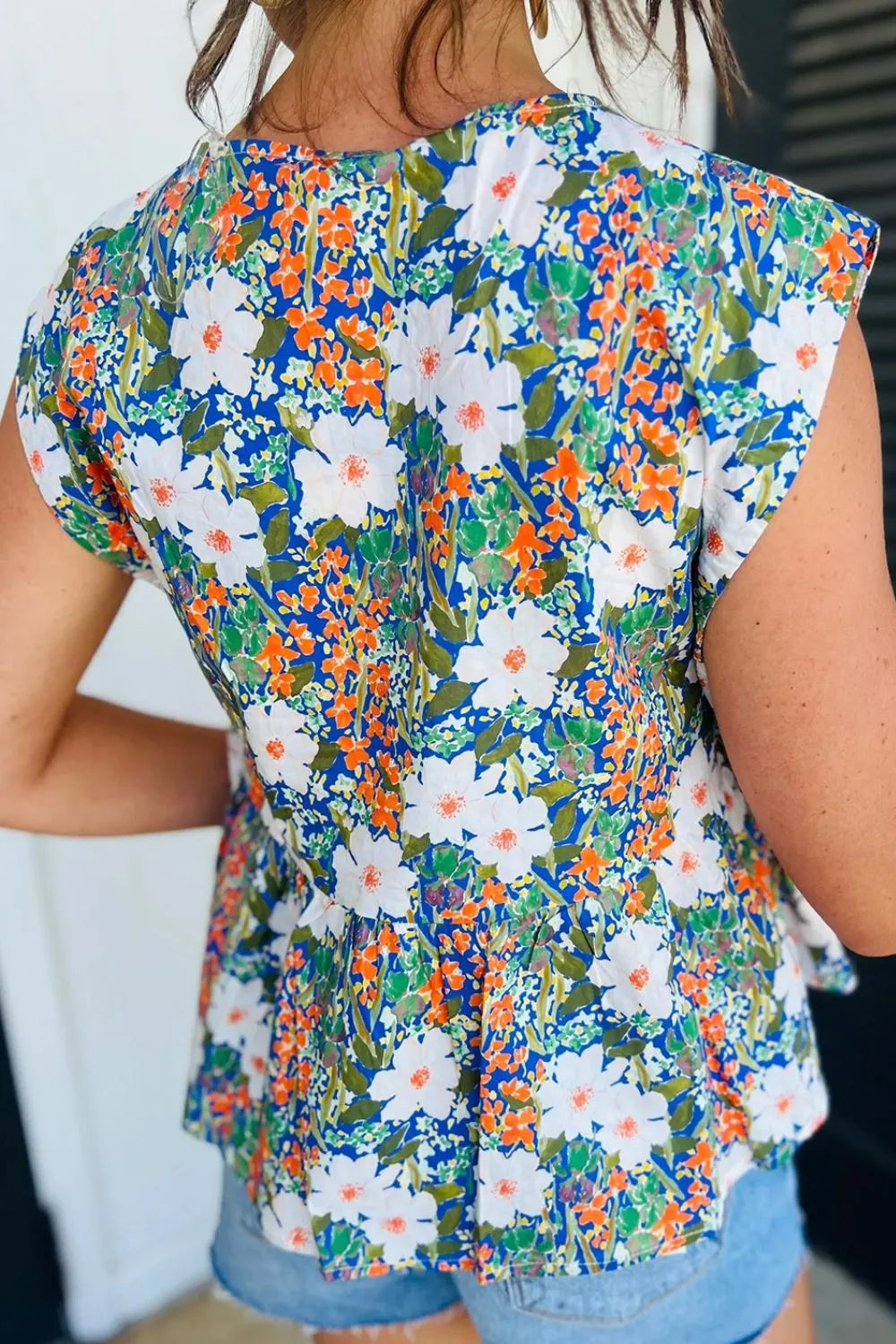 Floral Print Bow Applique Slit Sleeveless Peplum Blouse DAME BOHEME