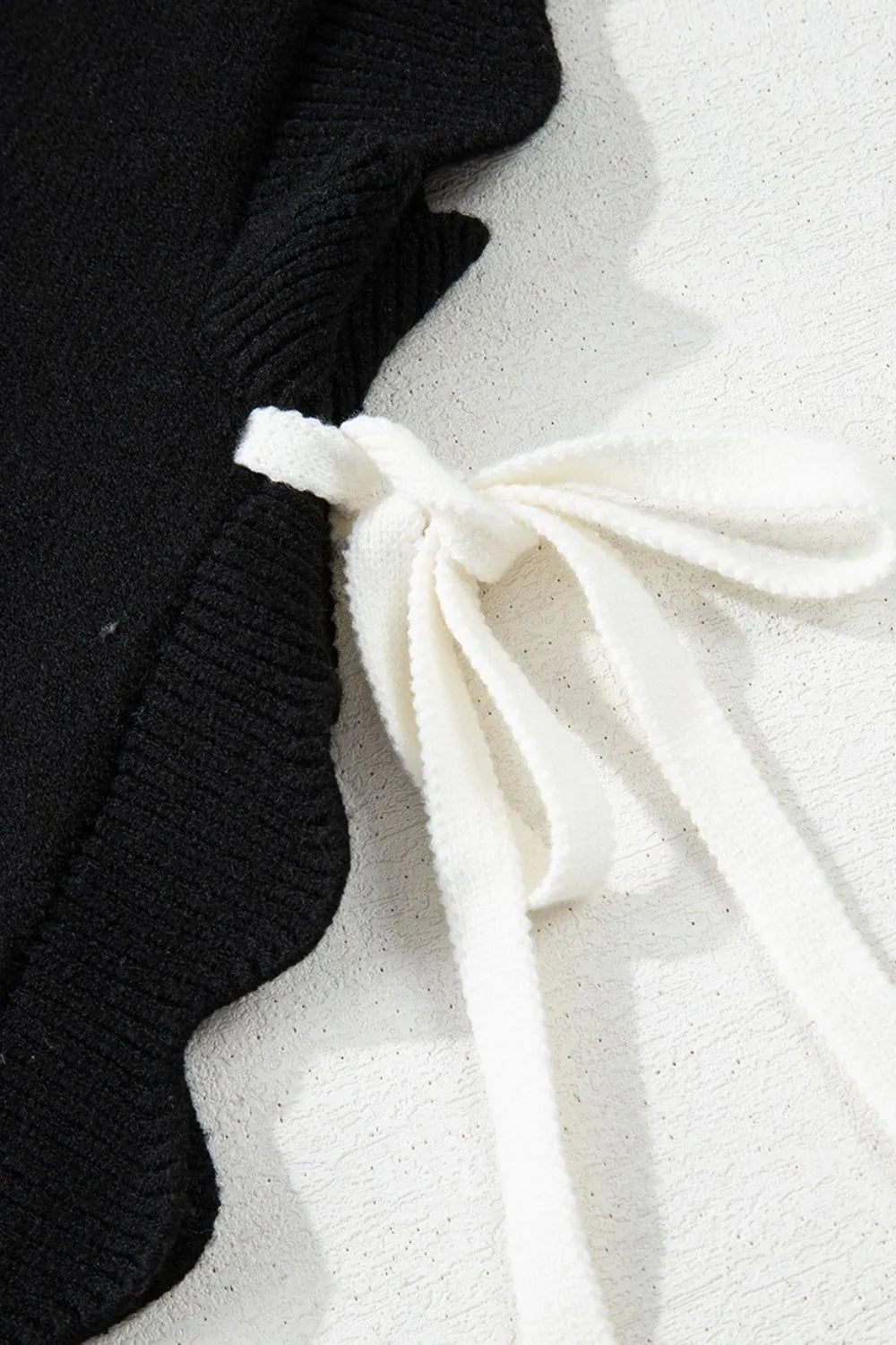 Bow Side Ties Scalloped Hem Cap Sleeve Sweater DAME BOHEME