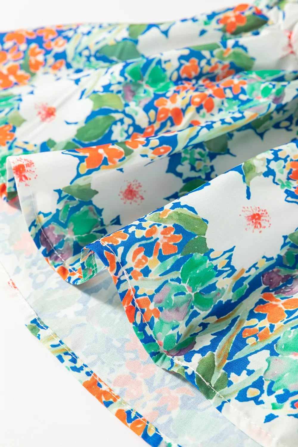 Floral Print Bow Applique Slit Sleeveless Peplum Blouse DAME BOHEME
